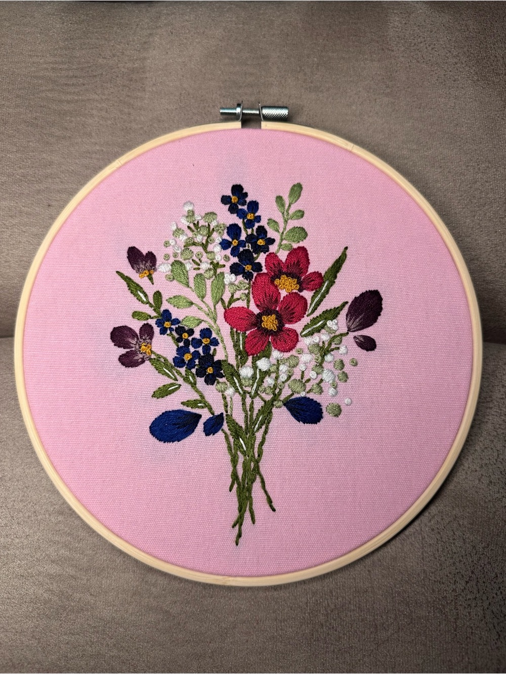 Hand-Embroidered Floral Bouquet Hoop on Pink Background